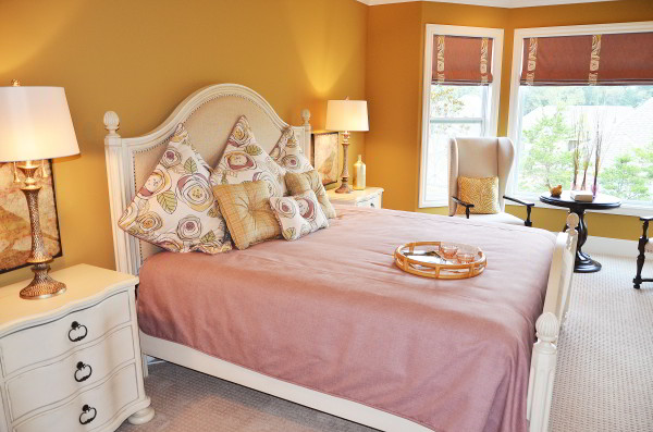 Add a playful touch to your bedroom decor with patterned throw pillows. 