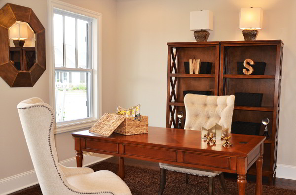 Keep your workspace clean by using storage bins and baskets to file paperwork in your home office. 
