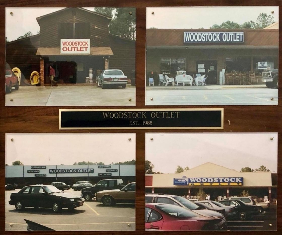 Plaque showing photos of Woodstock Outlet's store fronts evolving over time