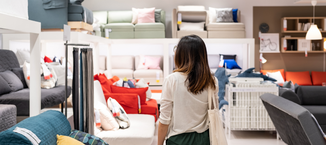 Prepare for an Unforgettable Shopping Adventure woman with brown hair and white shirt furniture shopping in a furniture store