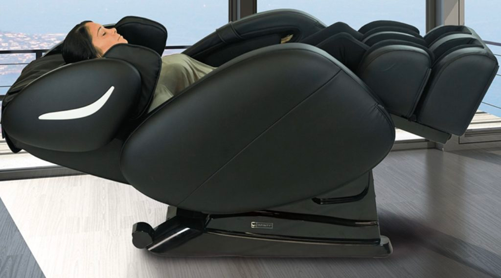 woman in green shirt reclining in an Infinity Smart Chair X3 massage chair