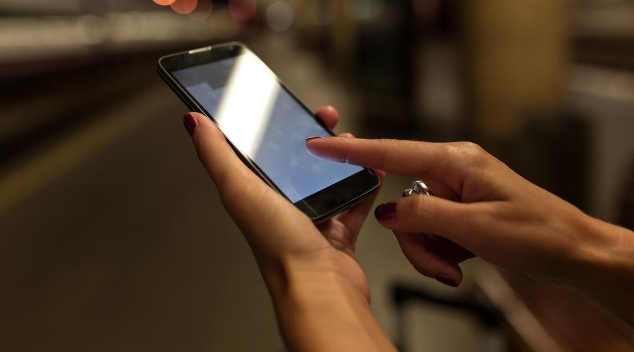 hands holding smartphone use financing apps