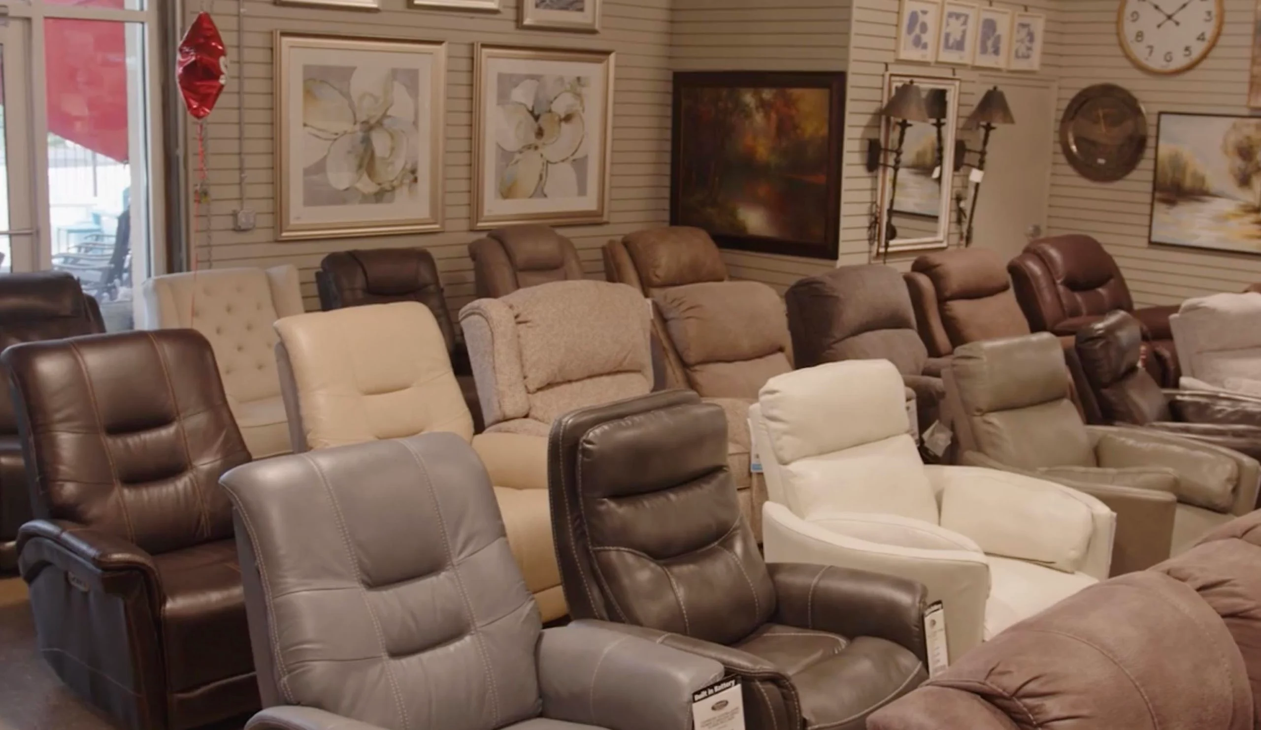 rows of recliners in store showroom floor